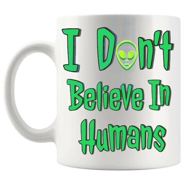 I Don't Believe In Humans Mug funny alien gift shown with handle on the left