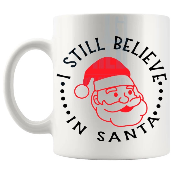 Still Believe In Santa Mug festive christmas gift design on a white mug shown with handle on the left