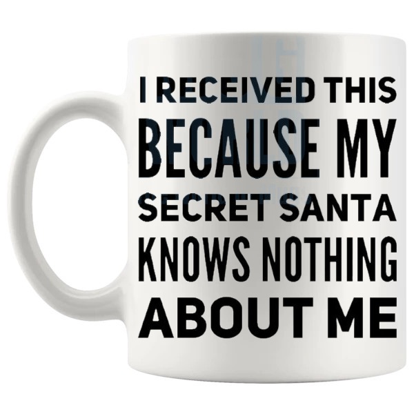 Secret Santa Knows Nothing About Me Mug funny secret santa gift design on a white mug shown with handle on the left
