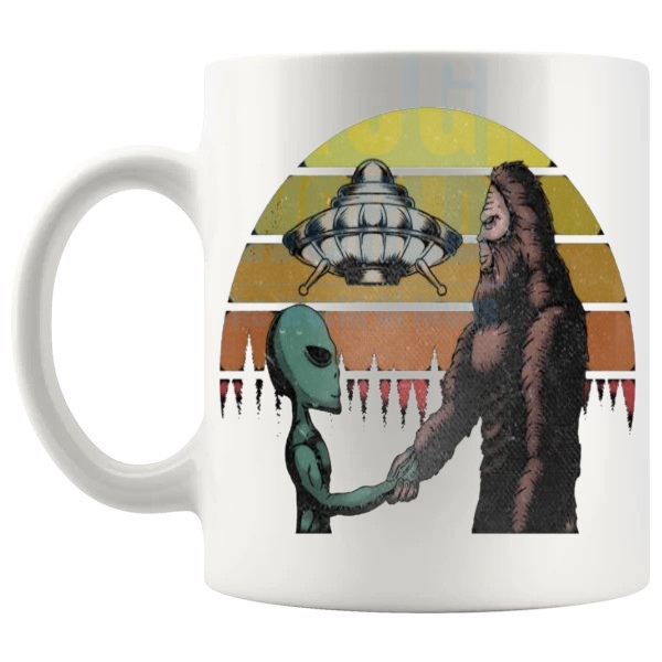 The Meeting Mug funny alien conspiracy gift shown with handle on the left