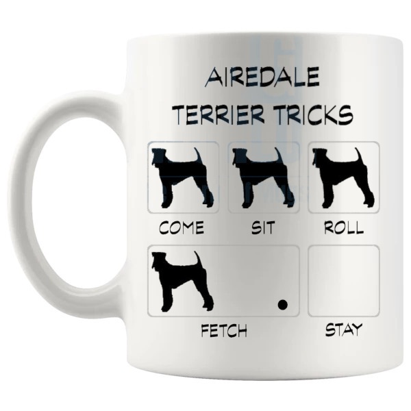 White 11oz ceramic mug showing funny Airedale Terrier tricks graphic with dog silhouettes. shown with handle on the left
