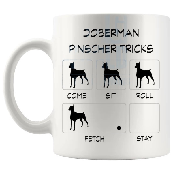 Doberman Tricks Mug funny dog breed gift for Doberman owners shown with handle on the left