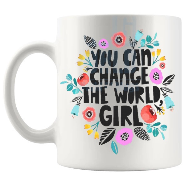 You Can Change The World Girl Mug with “You Can Change The World Girl” text design shown with handle on the left